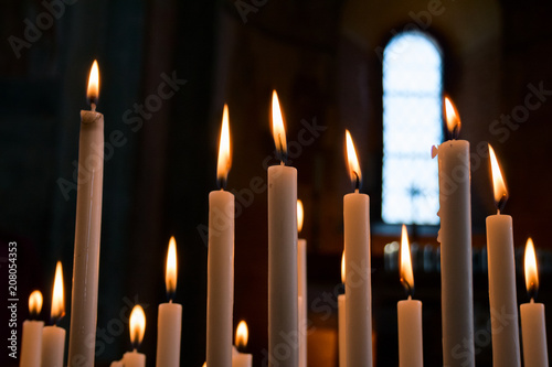 Cuadros en Lienzo Devotional candles lit inside a church.