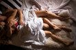 © Kaspars Grinvalds - Cozy couple lying in bed under the sheets