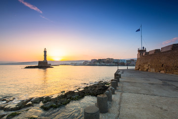 Wall Mural - Lighthouse of the old Venetian port in Chania at sunrise, Crete. Greece