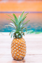 Wall Mural - Fresh yellow pineapple tropic fruit summer refreshment smoothie shake drink near pool