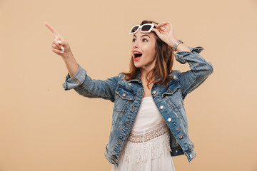 Wall Mural - Portrait of an excited young girl in summer clothes