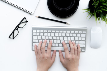 Fototapete - Flat lay of top view Business woman use keyboard on modern white desk work table with computer laptop and stationary in home office includes copyspace for add text or graphic