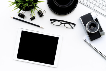 Fototapete - Flat lay of top view modern white desk work table with computer laptop,retro film camera and stationary in home office includes copyspace for add text or graphic
