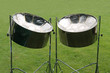 A Pair of Musical Metal Steel Drums on Stands.