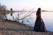© melissa - Girl in black dress by water