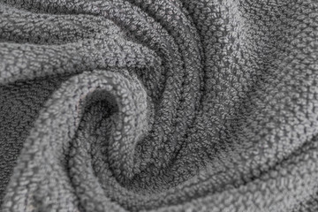 close up view on grey cotton towel. spa and wellness thing. selective focus