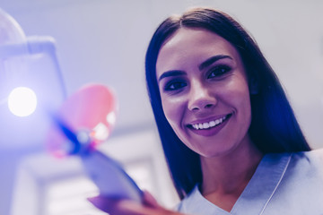 Wall Mural - dentist with uv lamp in the clinic