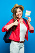 © Yuriy Shevtsov - woman ready for summer vacation with backpack and passport showi