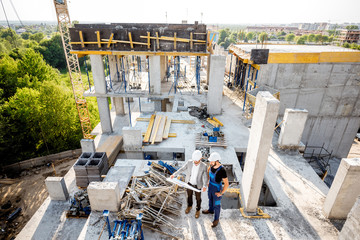 top view on the construction site of residential buildings during the construction process with two 