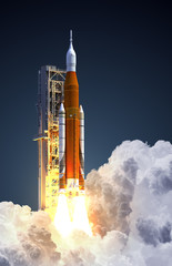 Wall Mural - Space Launch System Takes Off On Blue Background