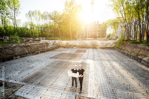 Cuadros en Lienzo Wide angle view on the concrete foundation at the construction site with two bui