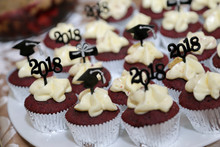 Chocolate Cupcakes With White Chocolate Topping Decorated Graduation Cap Hat For Happy Graduation Day Party Theme. Delicious Sweet Cake Dessert.