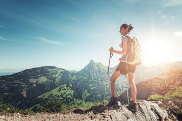 Wall Mural - healthy fit young woman hiker on a mountain summit