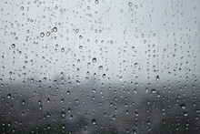 Depression And Dreary Sad Weather Shown As Water Droplets On A Window.