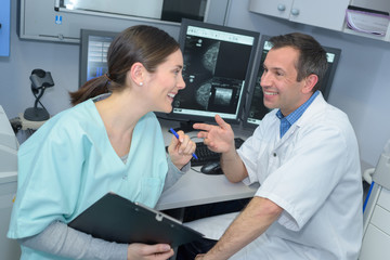 Two medical workers laughing together