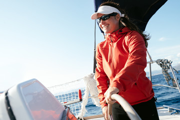 Wall Mural - Attractive strong woman sailing with her boat