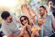 © ivanko80 - Close up of four young cheerful people eating pizza