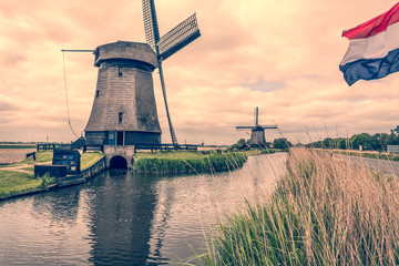 landscape with two windmills and dutch flag. Oterleek netherlands holland