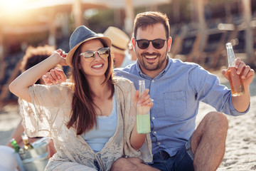 Wall Mural - Happy young couple on the beach