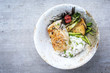 Modern Japanese fried cod fish filet with green asparagus and rice as top view in a bowl with copy space left
