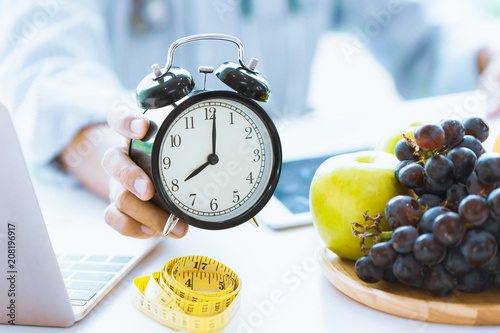 Fotografie, Obraz Times to Healthcare or Diet Food advisor show clock for timing care your health with healthy food and concept