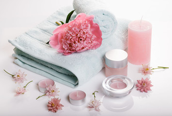 Wall Mural - Spa concept in Valentine's Day, Birthday Day, pink peony, candles, blue towels, flowers. Spring or summer background