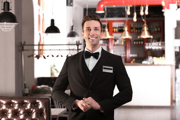 waiter in elegant uniform at workplace