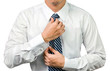 © badeleven - Business man dress up wearing his tie
