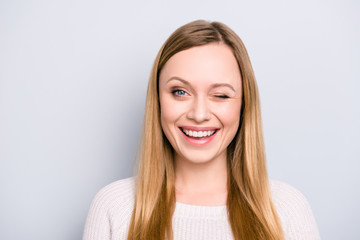 head shot portrait of charming pretty laughter lovely girl in good mood winking with one eye isolate