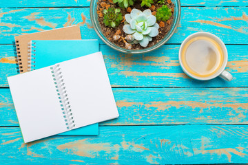 Wall Mural - Cup of coffee with notebook on wooden desk