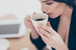 © deagreez - Close up cropped portrait of dreamy lovely woman  drinking coffee holding cup enjoying aroma having pleasure. Recreation idyllic delight concept