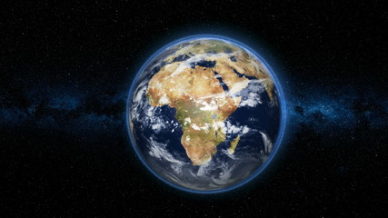 realistic earth planet, rotating on its axis in space against the background of the milky way star s