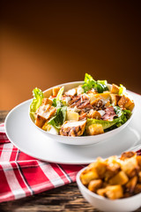 Canvas Print - Delicious salad caesar with grilled chicken breast croutons eggs bacon parmesan cheese and  lettuce with dressing