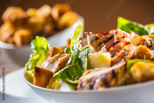 Fotomural Delicious salad caesar with grilled chicken breast croutons eggs bacon parmesan