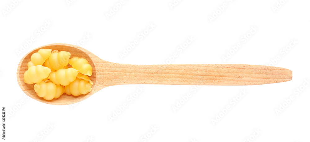 Wooden spoon with raw pasta on white background