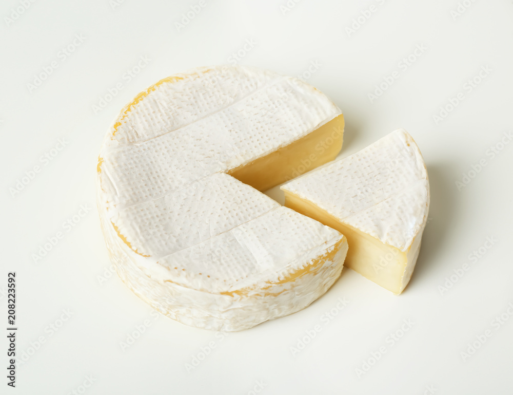 Delicious brie cheese on white background