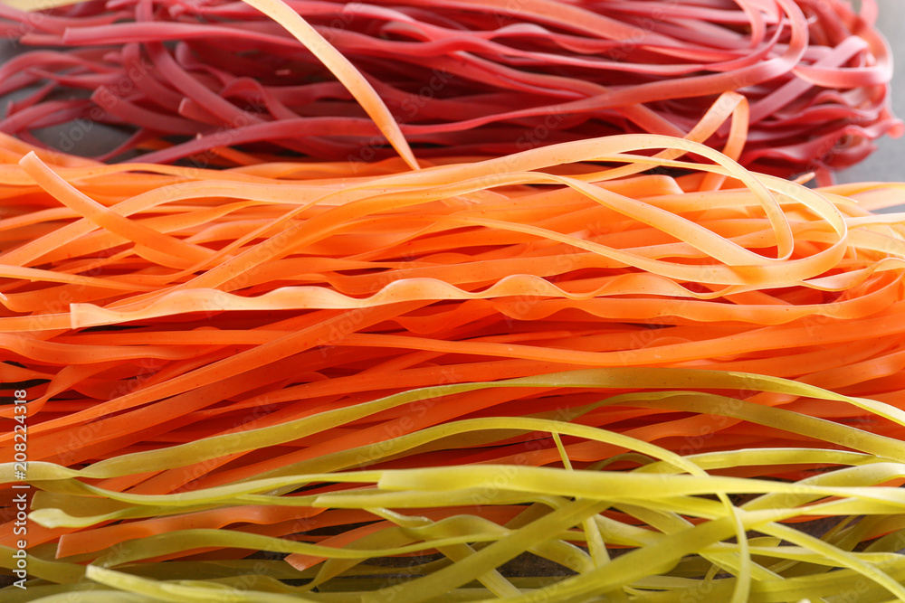 Uncooked pasta as background, closeup