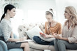 © Viacheslav Yakobchuk - Family therapy. Blond mother talking to female psychologist and teen girl listening to music