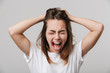 © Drobot Dean - Scared screaming sad disabled young girl
