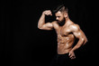 © producer - strong bodybuilder posing in studio