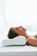© puhhha - Orthopedic Pillow. Woman Lying In Bed