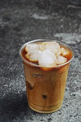 Wall Mural - Iced latte to go on the dark backgroind. Iced coffee isolated 