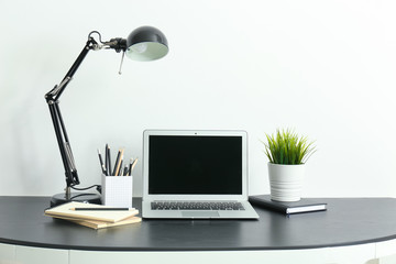 Comfortable home workplace with laptop on table