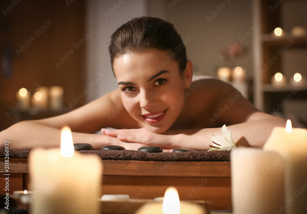 Young woman relaxing in spa salon
