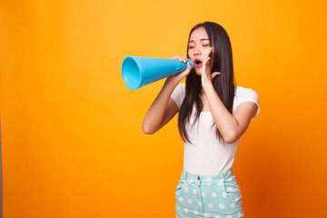 Beautiful young Asian woman announce with megaphone.