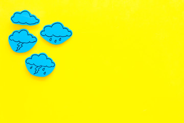 Wall Mural - modern weather icons set on yellow background top view copy space