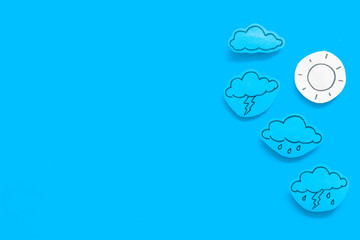Wall Mural - modern weather icons set on blue background top view copy space