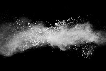 Wall Mural - bizarre forms of of white powder explosion cloud against dark background.launched white dust splash 