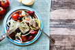 Greek salad plate with tomatoes, feta, olives and onions nice decoration