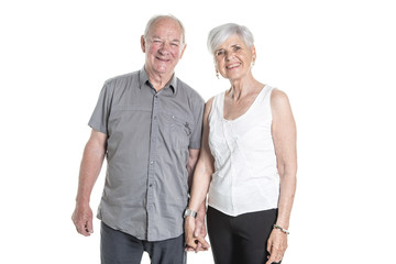 Senior couple posing on studio white background